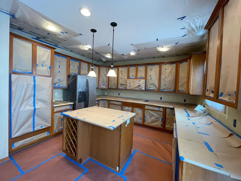 Kitchen fully masked and protected before painting